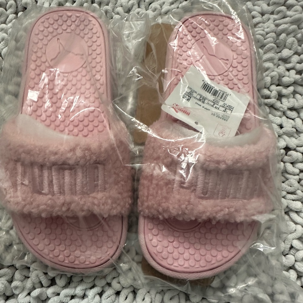 New with tags Puma slides. Pink. Women’s size 5.